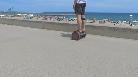 Biking and Skating Next to the Beach in Slow Motion 스톡 동영상 96203622