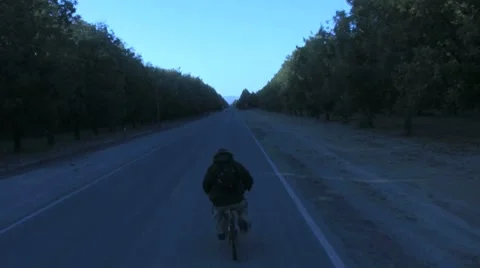 Biking Cold Down the Road Stock Footage 8692357