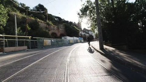 Biking up hill Stock Footage 129750306