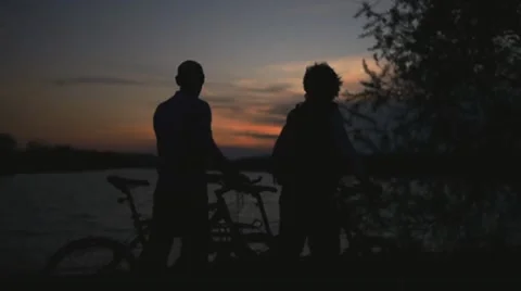 Biking at sunset Stock Footage