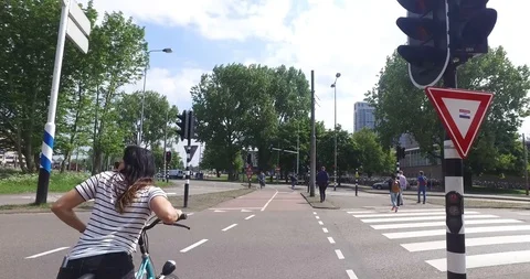 Biking through Amsterdam 스톡 동영상 114176780