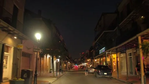 Biking through French Quarter New Orleans Louisiana at night Stock Footage