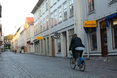 Biking Through Old Street in Gothenburg, Sweden Stock Photos