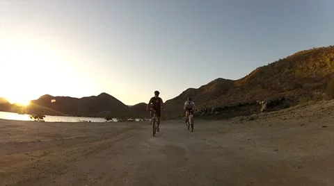 Biking Through The Sunset Stock Footage 22102080