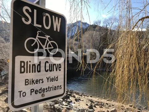 Biking Trail Sign Showing Possible Danger Ahead Stock Photos