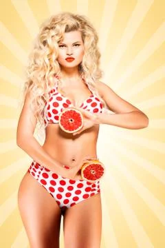 Bikini and grapefruit. Stock Photos