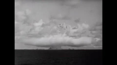 BIKINI ATOLL - 1946 - Dramatic clouds rise from the ocean as a fifth atomic bomb Stock Footage 341971127