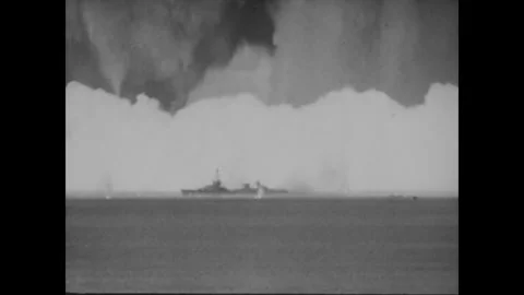 BIKINI ATOLL - 1946: Ship below - Dark cloud presses over bright spray Stock Footage 344498606