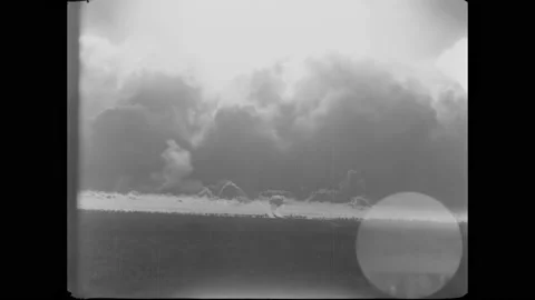 BIKINI ATOLL - 1955 - Distant view of an atomic bomb being detonated in the 스톡 동영상 304157191
