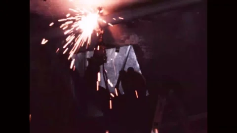 BIKINI ATOLL - 1969 - Man cuts protruding pipes inside a bunker with a torch as Stock Footage 308102405