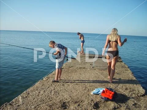 Bikini girl searching place to dive Stock Photos