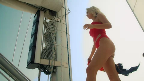 Bikini model on a sailboat 動画素材 247513240