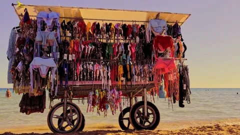 Bikini Sales stand on the beach. Sand. vacation. Stock Footage 214344321