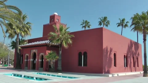 Bil Bil castle Andalucia red building deep blue sky palm trees Stock Footage 48466027