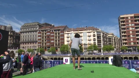 BILBAO, SPAIN; MAY 11 2018: Man kicking rugby ball at outdoor sports fan event Stock Footage 335467438
