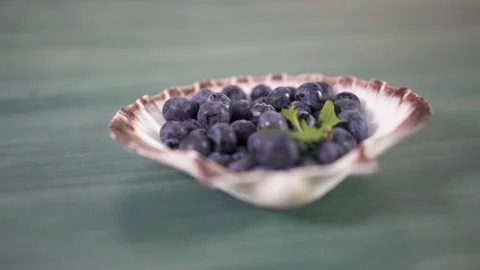 Bilberry for decorating a cake, close-up Slow motion Stock Footage 89886896