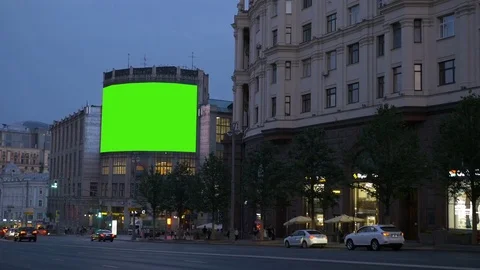 A Bilboard with a green screen on a busy street. Stock Footage