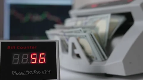 Bill counter showing quickly changing numbers of money counted.  Stock Footage 217517959