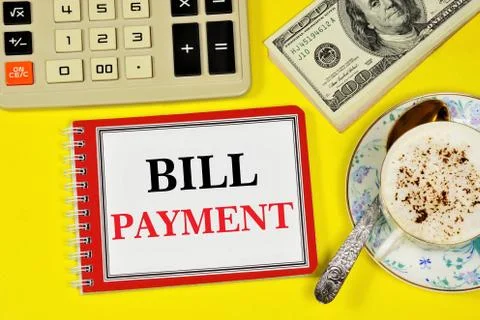 Bill payment. Text label in the form on the folder of planning documents. Stock Photos