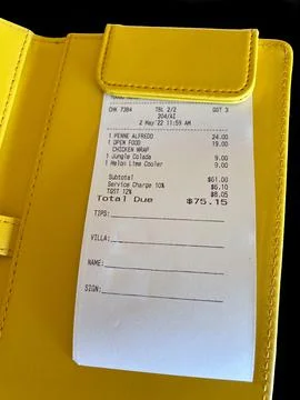 Bill presented in a holder Stock Photos