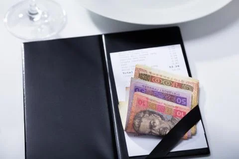 Bill With Ukrainian Banknotes In Folder Payment On Table Fotos de archivo