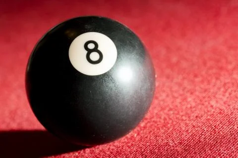 Billards pool or snooker game. the black eight ball. red cloth table Stock Photos