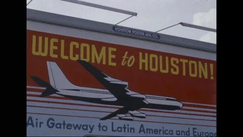 Billboard with airliner on it reading Welcome to Houston - 1965 Stock Footage 101920927