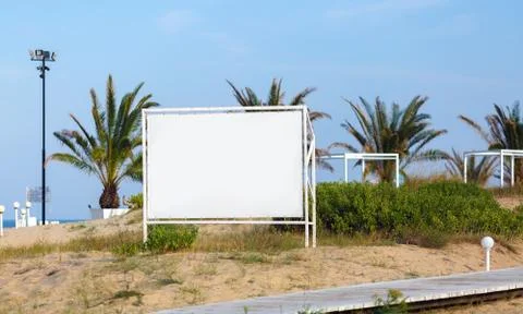Billboard on the background of palm trees Stock Photos