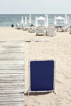 Billboard on the beach. Stock Photos