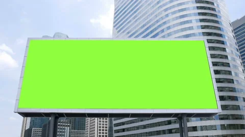 Billboard with a blank green screen mock-up in front of office building Stock Footage