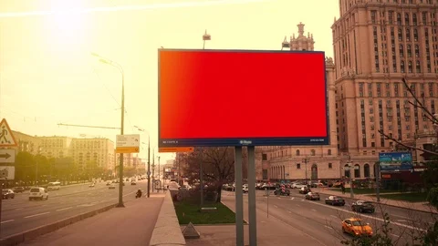 A Billboard with a Blank Red Screen on a Busy Street Stock Footage 77063968