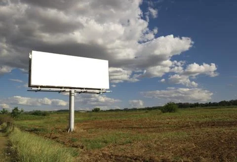 Billboard - Empty billboard in front of beautiful cloudy sky in a rural locat 스톡 사진