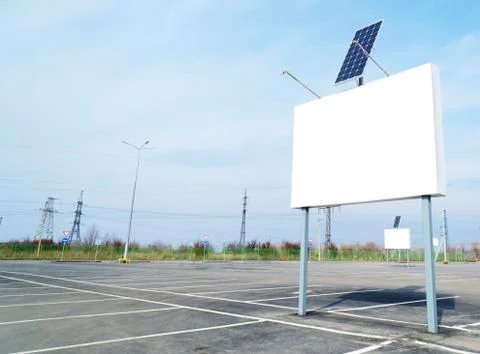 Billboard on empty parking with solar panel 스톡 사진