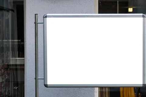 Billboard in front of an window of an small clothes shop Foto stock