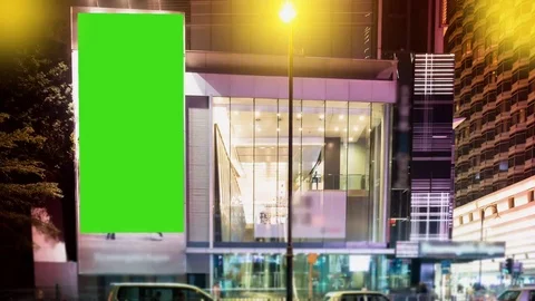 A Billboard with a Green Screen on a Evening Streets of Hong Kong .Time Lapse Видео 73524348