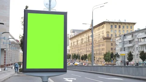 A billboard with a green screen located at ul. Nearby there is a road bridge on Video stock 142697545