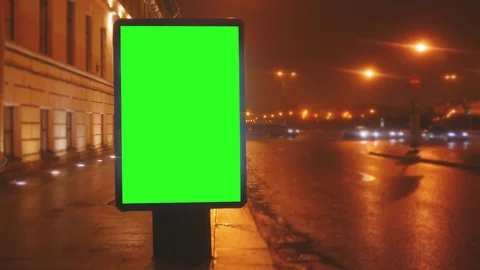 A Billboard with a Green Screen on a Streets Video stock 71963834