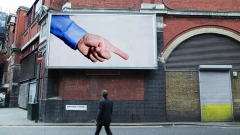Billboard pointing at a pedestrian Video stock 103871567