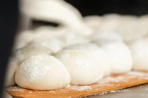 Billets of dough for baking bread, stand on proofing and taking shape 写真素材