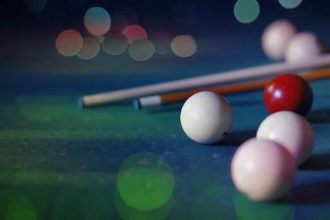 Billiard balls and cue on pool table. Russian billiards. Close-up of items .. Stock Photos