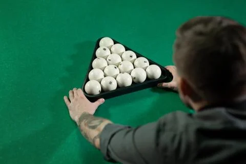 Billiard balls arranged in a triangle viewed from above. Stock Photos