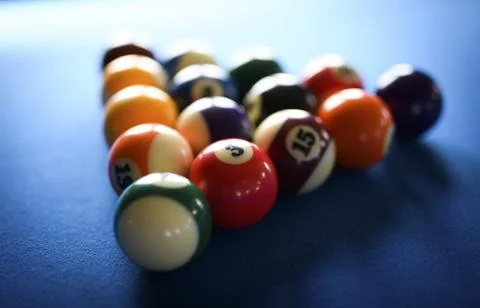 Billiard balls on a blue table Stock Photos