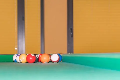 Billiard balls in the corner of the pool table. Stock Photos