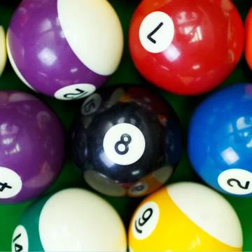 Billiard balls on a green pool table, closeup Stock Photos