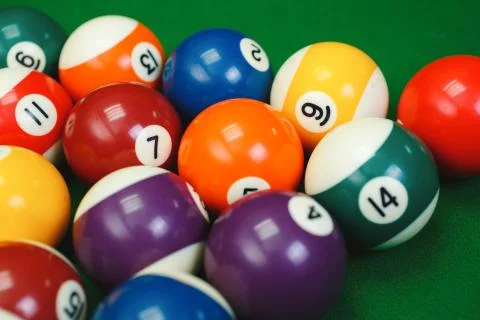 Billiard balls on a green pool table, closeup Stock Photos