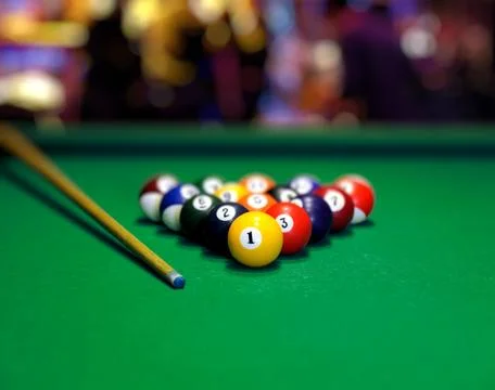 Billiard balls in a green pool table Stock Photos