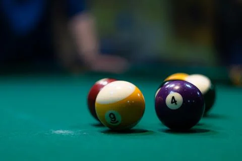 Billiard balls on green table in pool club copy space Stock Photos