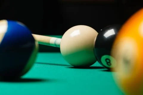 Billiard balls in a pool table. Stock Photos