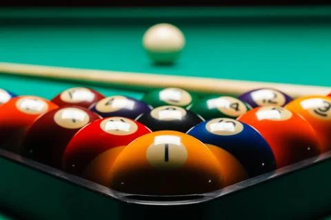 Billiard balls in a pool table. Stock Photos