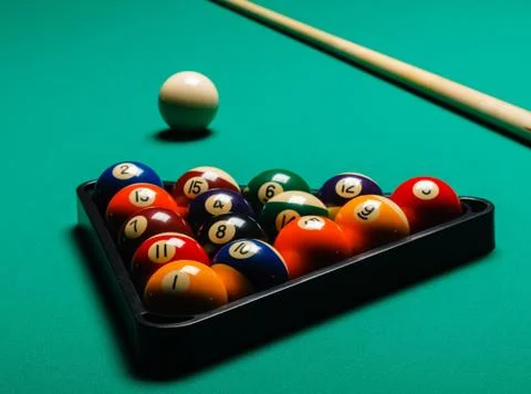 Billiard balls in a pool table. Stock Photos